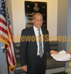 a lang handing in documents to state