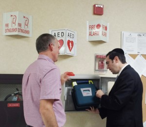 Twp Engineer Jeff Steiger and Mayor Miller Inspect AED