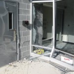car into office building pic