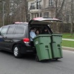 kids shlepping bins in car tls